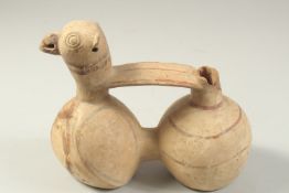 AN UNUSUAL POTTERY VESSEL WITH BIRD HEAD, 20cm long.