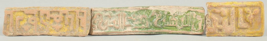 A COLLECTION OF THREE RARE 8TH - 9TH CENTURY UMAYYAD YELLOW AND GREEN GLAZED BORDER TILES, depicting