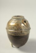 A BRASS MOUNTED COCONUT HUQQA BASE.
