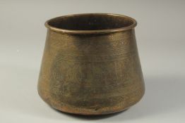 AN ISLAMIC ENGRAVED BRASS BASIN, 17cm high.