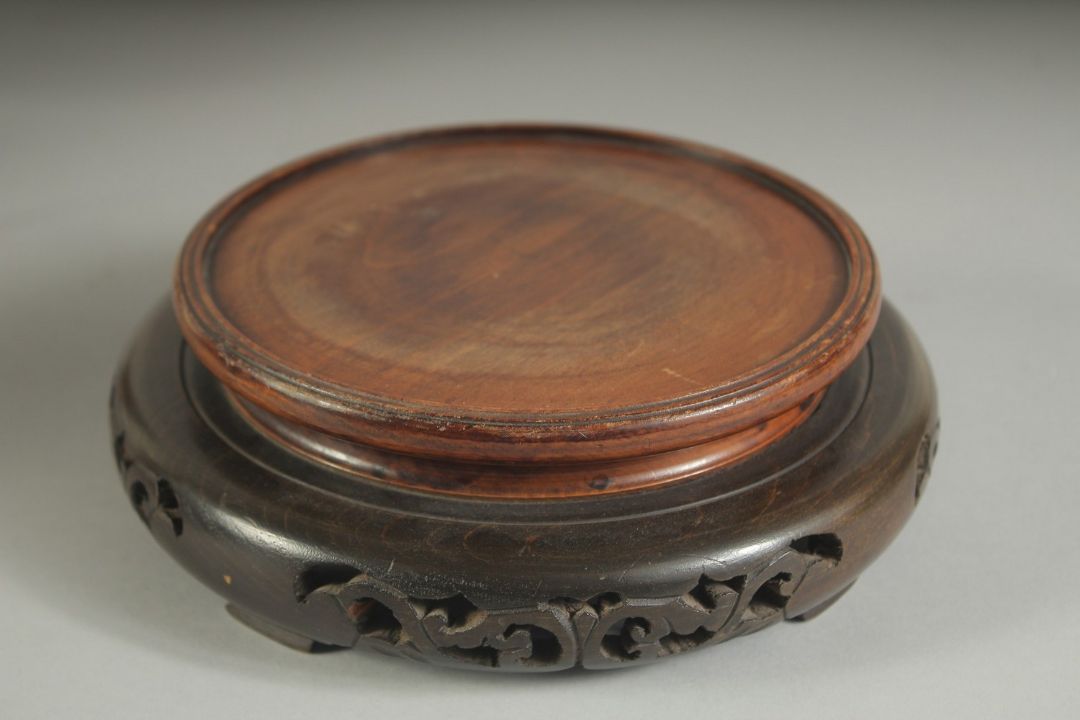 A CHINESE CARVED HARDWOOD CIRCULAR STAND, with pierced base, the stand to house a base of 14cm - Image 3 of 4