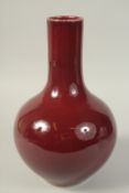 A LARGE CHINESE SANG DE BOEUF VASE, the base with character mark, 34cm high.