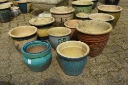 A quantity of glazed plant pots.
