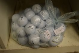 A bag of fifty Top Flite golf balls.