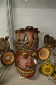 A large colourful tribal mask.