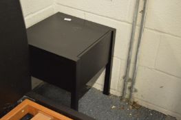A pair of black lacquer bedside tables.