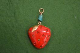 An unusual decorative pendant with gold mount modelled as a strawberry.