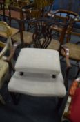 Chippendale style mahogany chair with arms together with a similarly upholstered stool.