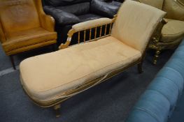 A gilt wood chaise longue.