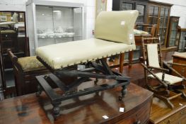 A Victorian ebonised framed gout stool.