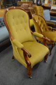 A Victorian mahogany framed and upholstered open armchair.