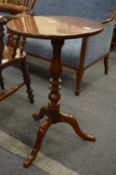 A 19th century mahogany tilt-top oval tripod table.