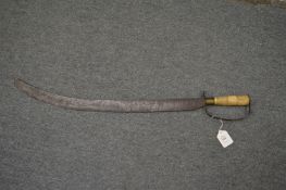 An Eastern cutlass style sword with carved bone grip and engraved blade.