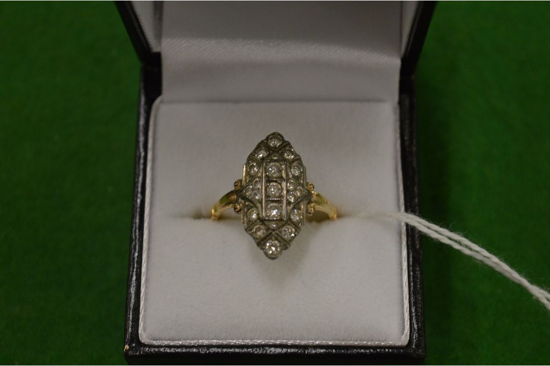 A yellow gold and diamond marquise shape ring, size O.