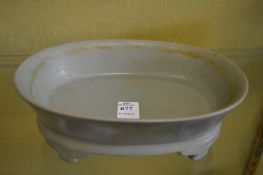 A Chinese celadon glazed shallow brush washer or jardiniere.