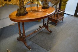 A Victorian walnut oval stretcher table.