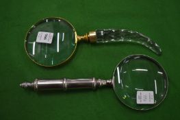 Two magnifying glasses.