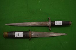 A Taylors Eye Witness dagger together with another dagger/plug bayonet.