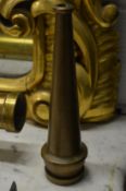 A small brass fire fighting nozzle.