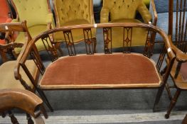 An Edwardian inlaid mahogany salon settee.
