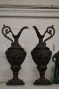 A pair of classical style spelter ewers.