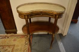 A French ormolu marble and mahogany kidney shaped two-tier occasional table.
