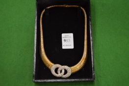 A stylish necklace with entwined circle design.