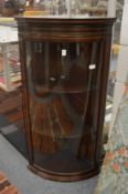 A good Edwardian inlaid mahogany bow front hanging corner display cabinet.