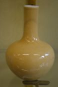 A Chinese yellow glazed bulbous shaped vase.