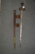 A good African sword with embossed leather scabbard.