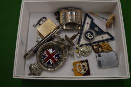 An RAC radiator or bumper badge together with other items.