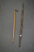 An Eastern sword and scabbard (blade corroded and unable to remove from scabbard) together with a