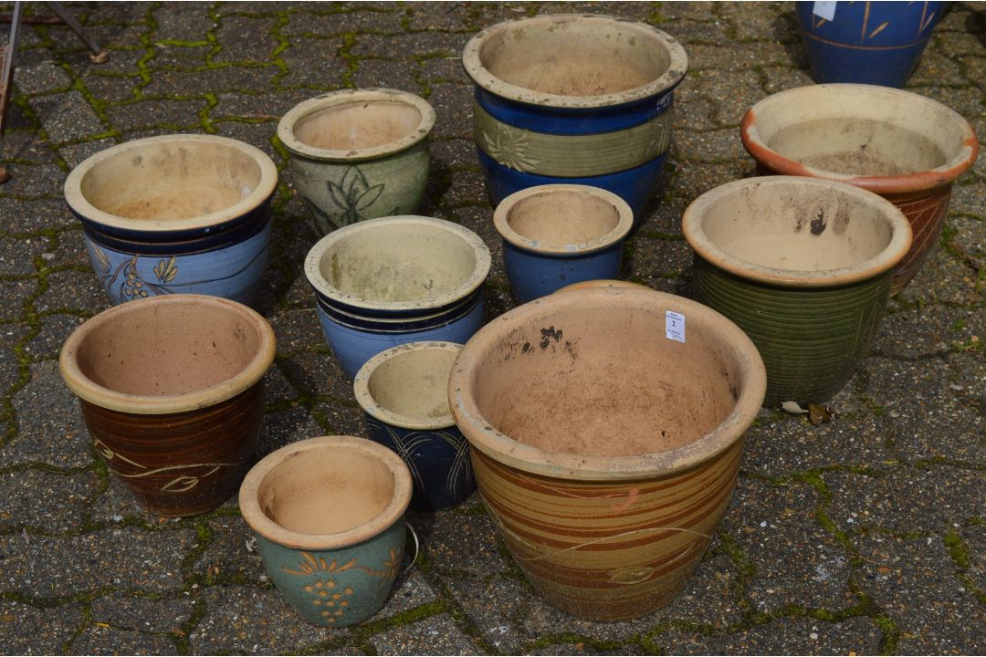 A quantity of glazed plant pots.