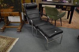 A Le Corbusier style style chrome framed recliner chair with matching stool.