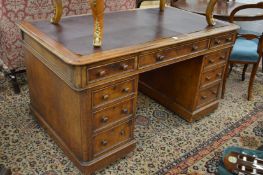 A Victorian oak pedestal desk.