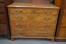A good George III mahogany straight front chest of four graduated long drawers with brass handles on