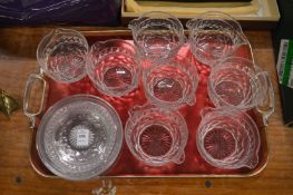 A set of eight cut glass wine rinsers with matching cut glass stands.