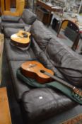A modern large brown leather upholstered two seater settee and matching armchair.