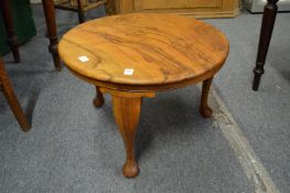 A walnut occasional table.