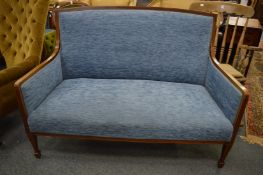 An Edwardian inlaid mahogany settee.