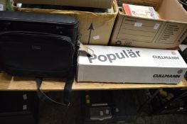 A boxed tripod and holdall.