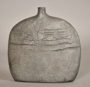 A studio pottery flattened vase with a textured metallic style finish, 7