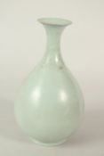 A CHINESE CELADON GLAZE VASE. 21cms high.