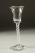 A GEORGIAN WINE GLASS with white opaque twist stem.
