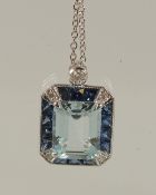 AN 18CT WHITE GOLD, AQUAMARINE AND SAPPHIRE PENDANT AND CHAIN.