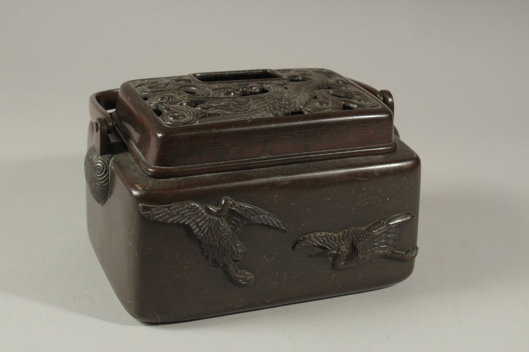 A GOOD CHINESE BRONZE SILVER INLAID CENSER with carrying handle and birds in relief. 18cms long. - Image 2 of 3