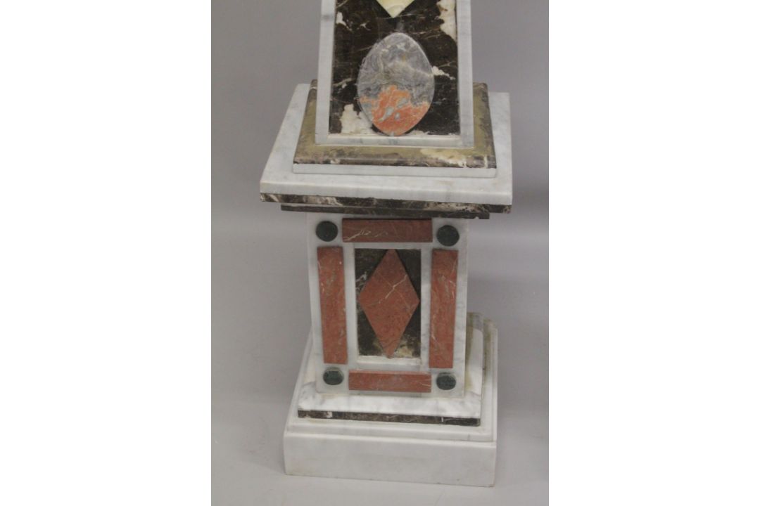 A GOOD PAIR OF COLOURED MARBLE OBELISKS ON STANDS. 6ft high. - Image 6 of 6