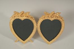 A GILT BRONZE DOUBLE HEART FRAME.