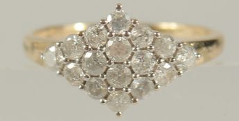 A 9CT YELLOW GOLD RHOMBOID RING SET WITH RBC DIAMONDS, boxed. Diamonds 0.80ct approx.