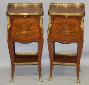 A SMALL PAIR OF LOUIS XVITH INLAID BEDSIDE CABINETS with brass gallery, brushing slide and three